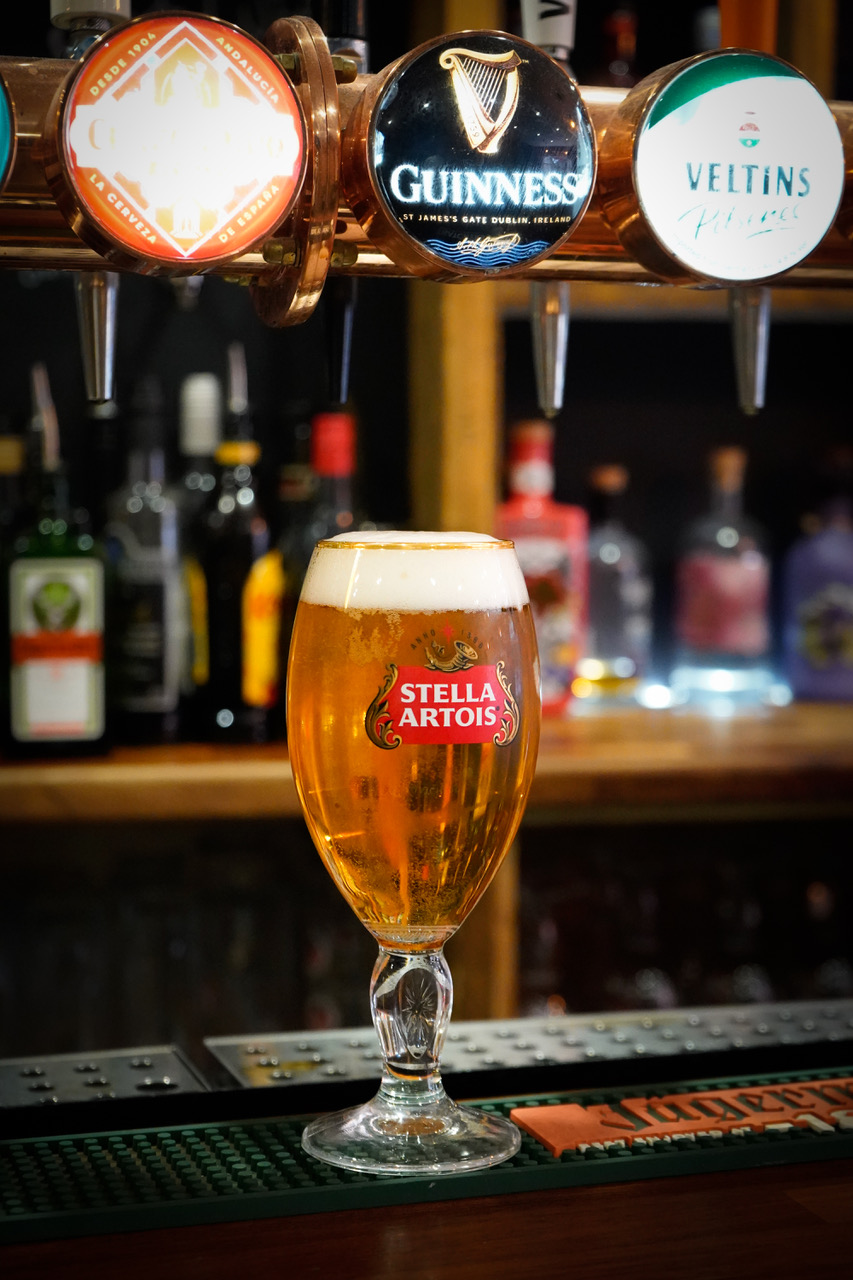 A cold pint poured at the bar