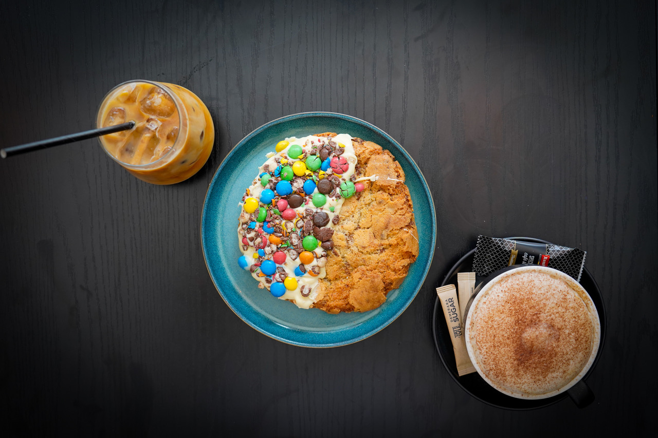 Giant cookie with coffee and iced latte