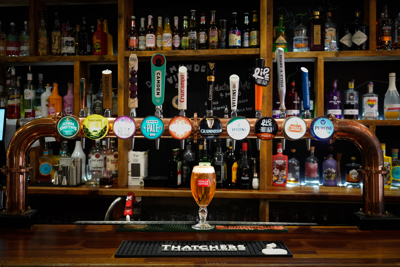 Copper tap tower with a freshly poured pint