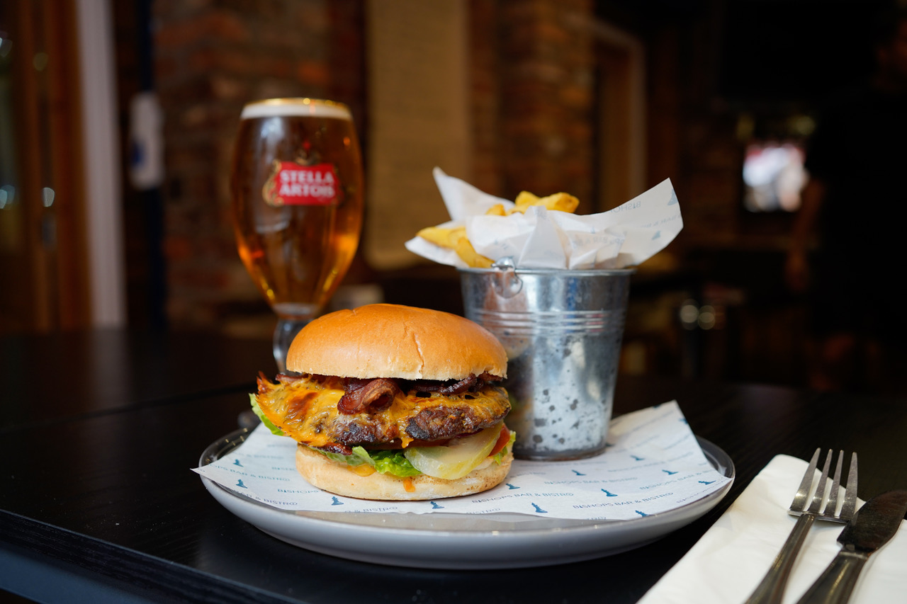 Bishops burger with chips and a pint