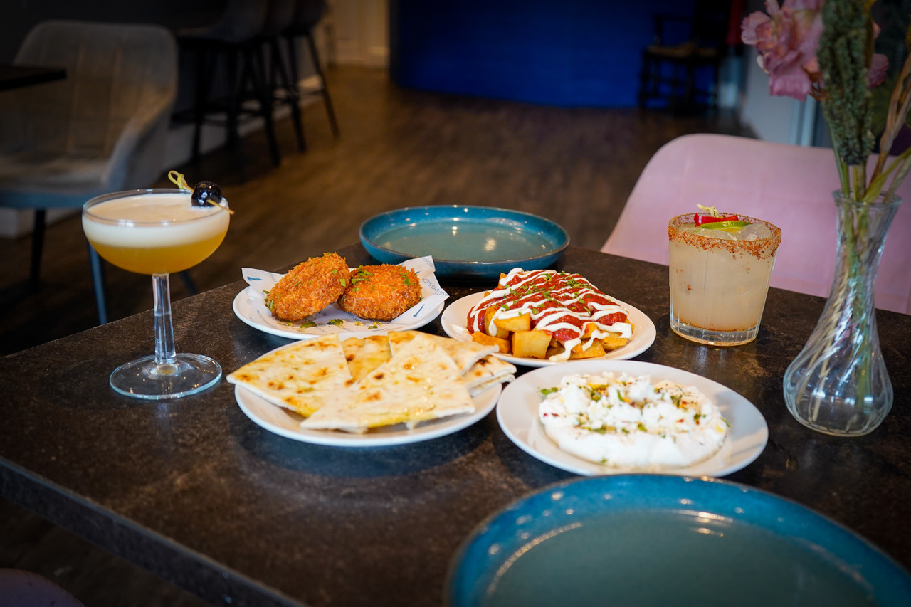 Tapas sharing plates with cocktails